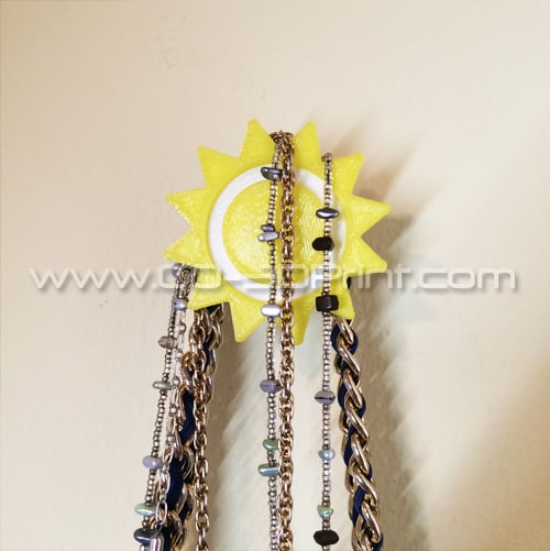Sonnenförmiger Wandhaken und Organizer für Mäntel und Schmuck